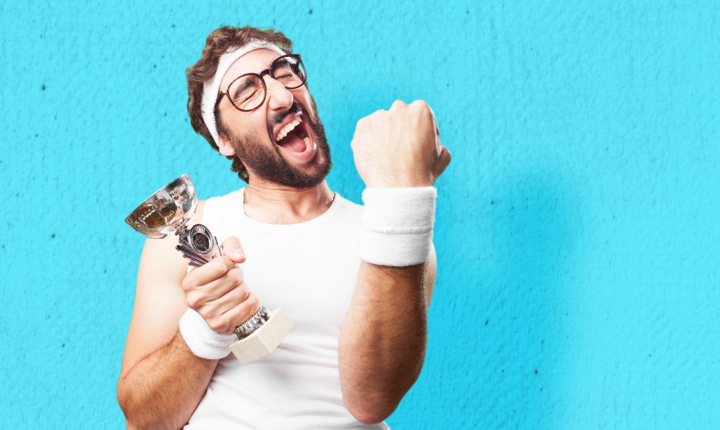 Man celebrating a win holding a trophy, representing good social content