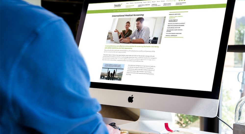 Internal page of Healix website on a computer with arm of person visible